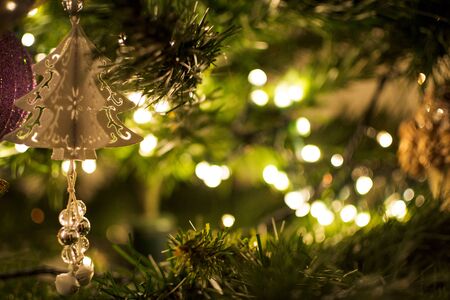 Close-up of a Christmas tree with blurred lights.の写真素材