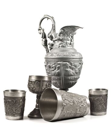 Five silver cups with medieval sculpture isolated on a white backgroundの写真素材