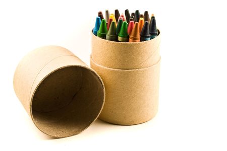 Colours pencil placed on a board box isolated on a white backgroundの写真素材