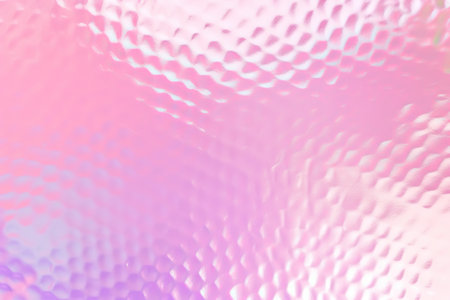 Abstract pink and purple gradient background with a textured wavy pattern.の素材