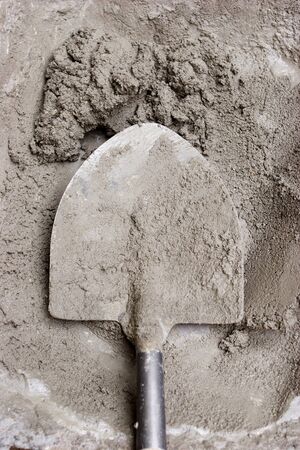 SHOVEL IN WET CEMENTの写真素材