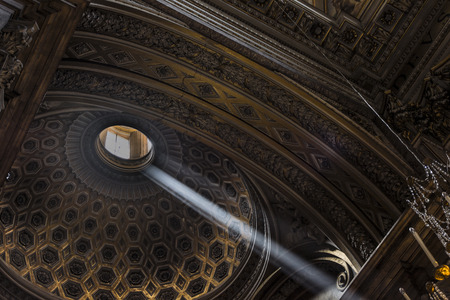 a ray of sunlight in a dark churchの写真素材