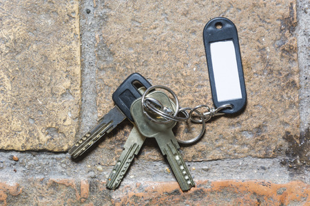 detail of a plastic keychain on the floor