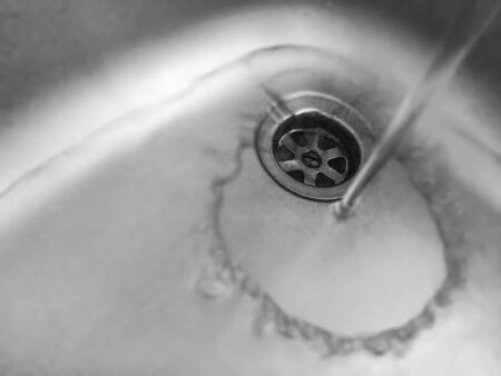 water jet on an aluminium sinkの写真素材