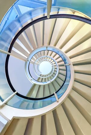 Modern spiral staircase shot from aboveの写真素材