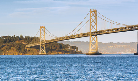 Bay Bridge at sunset in a warm autumnal dayの写真素材