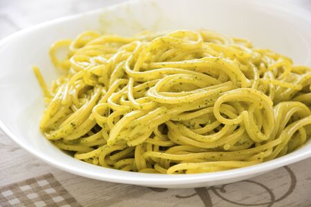 a portion of fresh italian spaghetti al pestoの写真素材