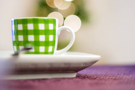 close up of a green striped coffee cupの写真素材