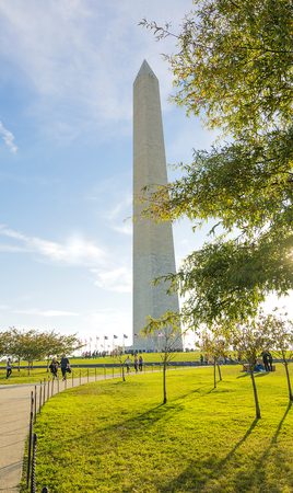 Washington, DC, USA, october 31, 2016: George Washington monument through green trees Washington DC USAのeditorial素材