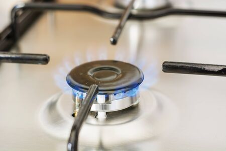 burning gas in range burner