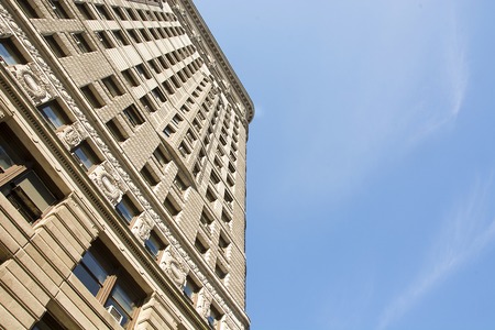 New York, USA, november 2016: Flat Iron building viewed from the bottom. Completed in 1902, it is considered to be one of the first skyscrapers ever built.のeditorial素材