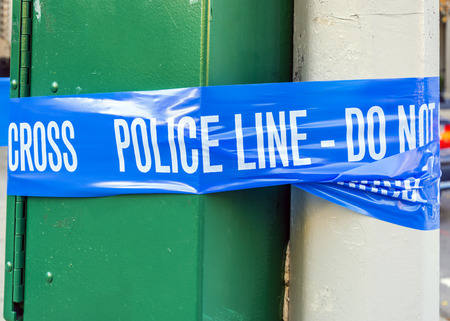 plastic blue police line with do not cross signの写真素材