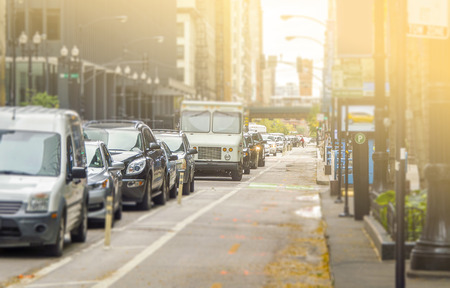 Lots of cars standing in the queue at roadway with the bike lane freeの写真素材
