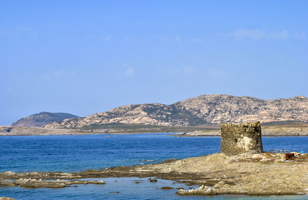 Amazing view of the famous La Pelosa Beach with the landmark 16th century Watchtower (Torre della Pelosa)の写真素材