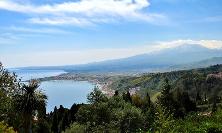The bay of Giardini-Naxos with the Etna in the background viewed from Taormina, Sicily Italy.の写真素材
