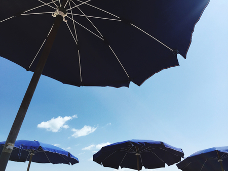 Beach umbrellas in a sunny dayの写真素材