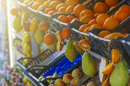 Typical citrus fruits of Sicily on sale in a market street of Taorminaの写真素材