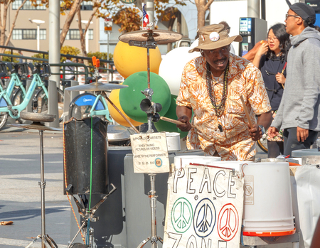 San Francisco, CA, USA, october 22, 2016: street musician playing buckets as drumsのeditorial素材