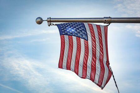 Hanging american flag with steel wires. patriotic concept.