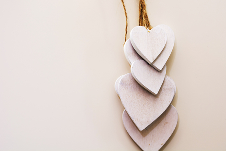 white wooden heart shaped decoration hangingの写真素材