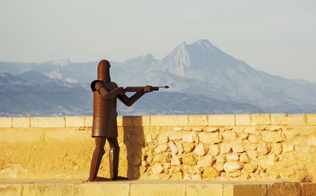 Alicante, Spain, may 1st, 2015: metal warrior using the crossbow in the castle of Santa Barbara of Alicante, spainのeditorial素材