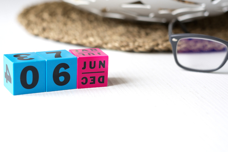 modern perpetual calendar composed of colored cubes and set at the date of June 6の写真素材