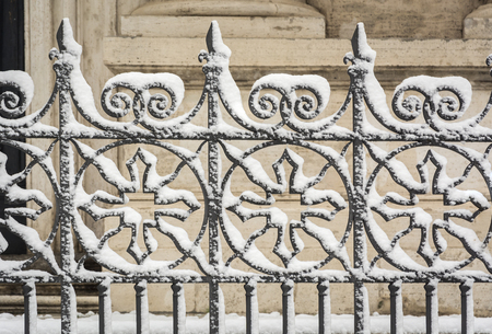 iron decorated gate covered with snow. Seasonal conceptの写真素材