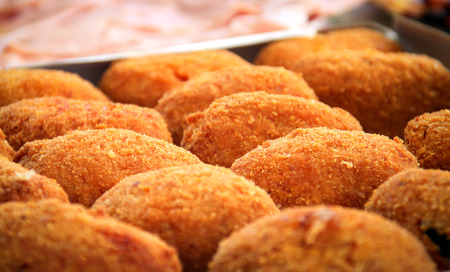 close-up view of a group of fried rice balls (Sicilian arancini)の写真素材