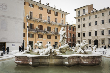 Rome, Italy, february 26 2018: the famous Moor Fountain (Fontana del Moro) in Piazza Navona after the unusual snowfall of 26 February 2018 in Rome, Italyのeditorial素材