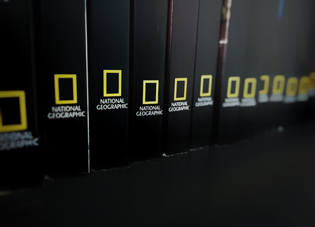 Rome, italy, June 29th 2018: spines of Black books stored in a shelf with the National Geographic logoのeditorial素材