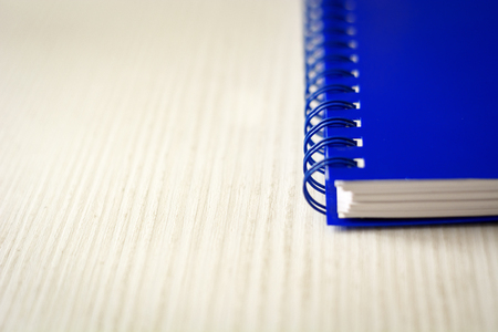 Spiral notebook isolated on a white table. Business and productivity concept. Spiral binding, stationery productの写真素材