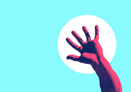 Male marble open hand in duo tone color effect. white circle in the background, purple on focusの写真素材