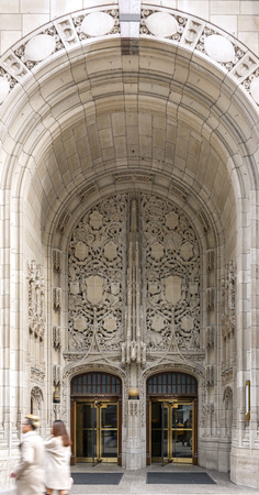 Chicago, Illinois, USA, October 2016: Entrance with a large decorated arch and revolving doors of the Tribune Tower in Chicagoのeditorial素材