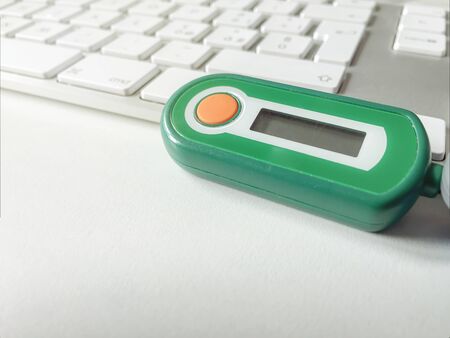 bank code generator with an orange button on a computer keyboard. Secure authentication. Safe...