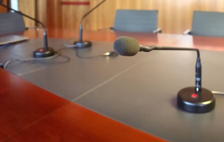 microphone on a wooden table of a boardroom. Business conceptの写真素材
