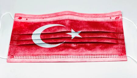 surgical mask with the national flag of Turkey printed. Pandemic covid-19 and preventive measures to counter the spread of the virusの写真素材