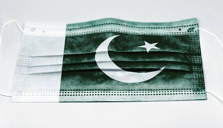 surgical mask with the national flag of Pakistan printed. Pandemic covid-19 and preventive measures...