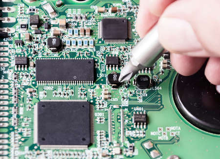 repairing a printed circuit board. Micro technology and repairs. Electronic components and...