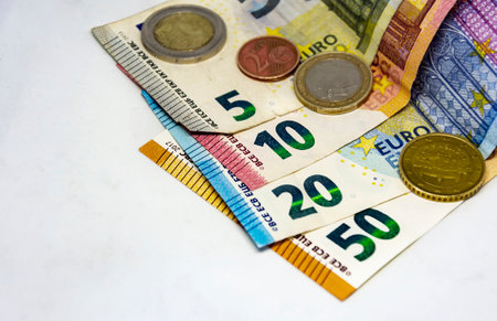 European Union coins and banknotes of different values. The euro is the European currency. Finance,...