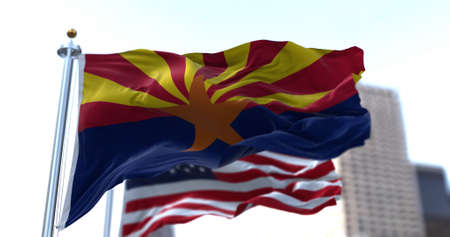The flags of the Arizona state and United States waving in the wind. Democracy and independence. American state. Seamless 3D animationの写真素材