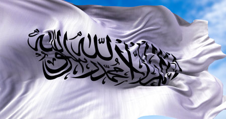 The flag of the Islamic Emirate of Afghanistan waving in the wind. It is an unrecognized Islamic emirate that was established by taliban in August 2021 with the fall of Kabulの写真素材