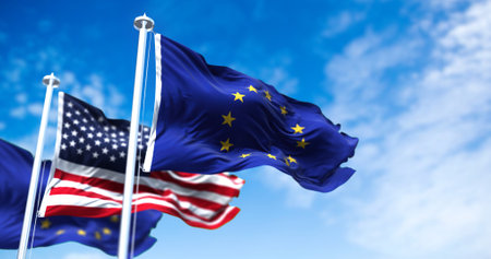The flags of the European Union and the United States of America waving in the wind. International relations and diplomacy.の写真素材