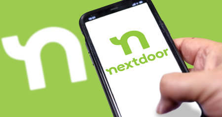 San Francisco, CA, USA, May 2021: The Nextdoor application home screen on a hand held smart phone...