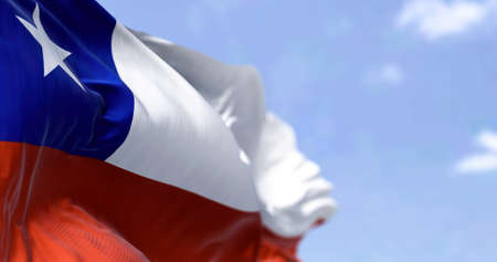 Detailed close up of the national flag of Chile waving in the wind on a clear day. Democracy and politics. South american country. Selective focus.の写真素材