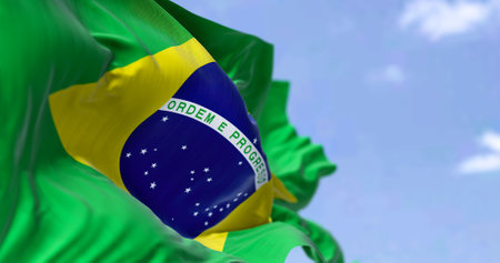 Detailed close up of the national flag of Brazil waving in the wind on a clear day. Democracy and politics. South american country. Selective focus.の写真素材