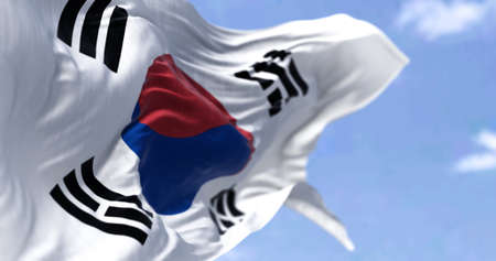 Detailed close up of the national flag of South Korea waving in the wind on a clear day. Democracy and politics. East Asian country. Selective focus.の写真素材