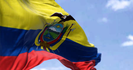 Detailed close up of the national flag of Ecuador waving in the wind on a clear day. Democracy and politics. South American country. Selective focus.の写真素材