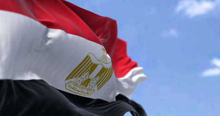 Detail of the national flag of Egypt waving in the wind on a clear day. Democracy and politics. Patriotism. Northeastern african country . Selective focus.の写真素材