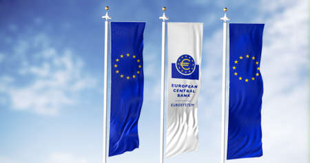 Frankfurt, Germany, February 2022: European flags waving in the wind with the white flag of the...