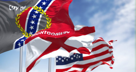 The flag city of Montgomery waving in the wind with the flags of Alabama state and United States of America. Democracy and independence. Montgomery is the capital city of the U.S. state of Alabamaの写真素材